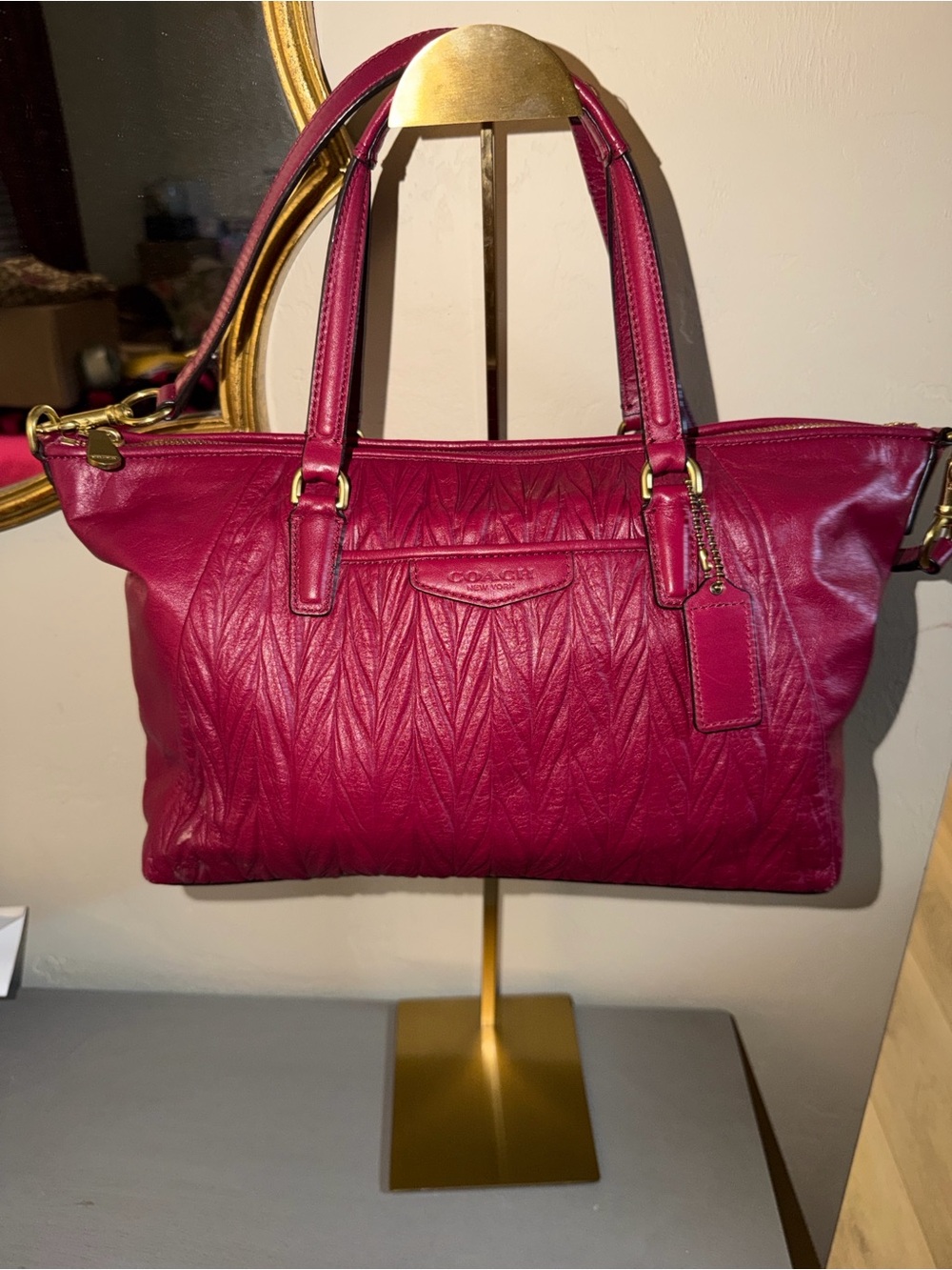 This is a Coach Madison magenta gathered leather satchel bag